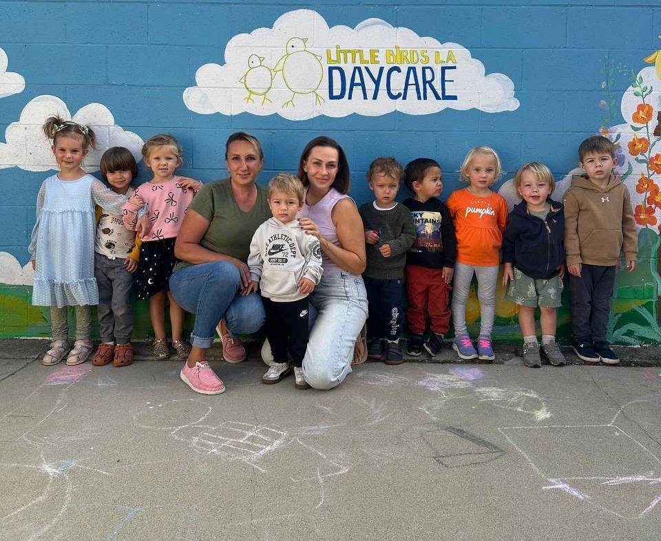 Our group by the daycare mural