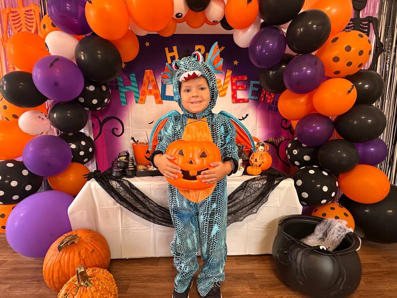 Halloween costume and pumpkin pail