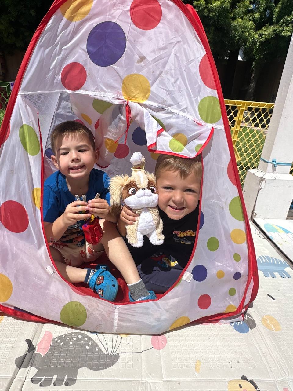 Two friends in the play tent